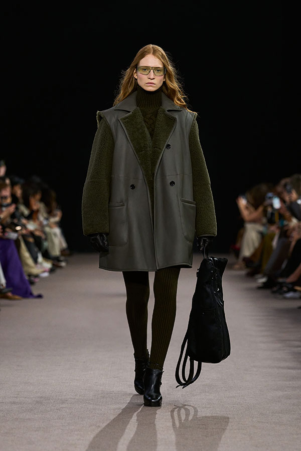 Max Mara Fall/Winter 2025 Fashion Show - Moss Green Look with Sheepskin Vest, Wool and Cashmere Dress, Leggings and Booties.
